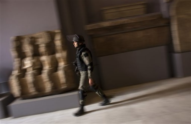 A member of the Egyptian special forces patrol on the main floor of the Egyptian Museum in Cairo, Egypt.